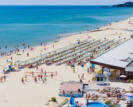 The Black Sea shore, blue clear water, beach with sand, umbrellas and sunbeds. Albena, Bulgariaのeditorial素材