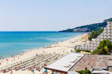 The Black Sea shore, blue clear water, beach with sand, umbrellas and sunbeds. Albena, Bulgariaのeditorial素材