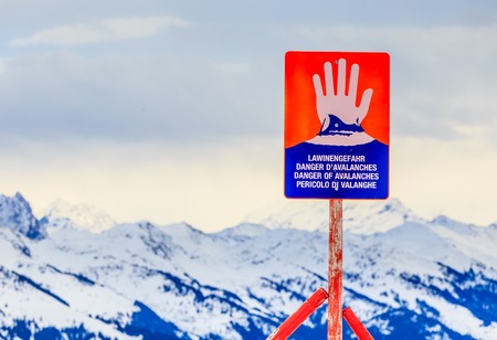 Sign "Danger of avalanches"  on top of the mountain  Hohe Salve. Ski resort  Soll, Tyrol, Austriaの写真素材