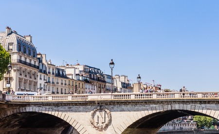 Saint-Michel bridge on Seine river in Paris, Quai des Grands Augustins. Franceのeditorial素材