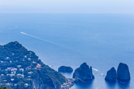Italy. Island Capri. Faraglioni rocks and boats from Monte Solaro, in Anacapriの写真素材