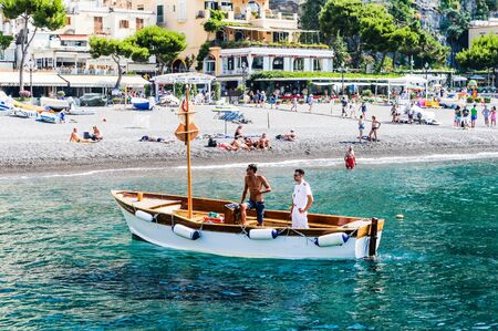 Tourist ship  in visitfamous and picturesque port in Positano. Italyのeditorial素材