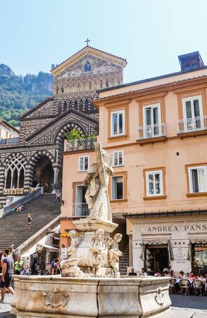 Fountain with the statue of St. Andrew and  Cathedral of St Andrea in the main square of Amalfi. Italiaのeditorial素材