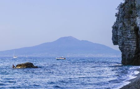 The beach on Amalfi Coast,  the volcano Mount Vesuvius in the background. Vico Equense. Italyのeditorial素材
