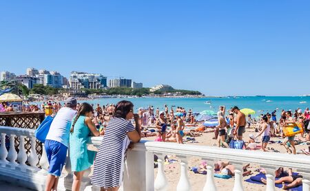 People resting on beach of resort the Black Sea Coast of Gelendzhik town. Krasnodar region, Russiaのeditorial素材