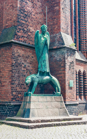 Statue Geistkampfer in front of the church in Kiel, Germanyのeditorial素材