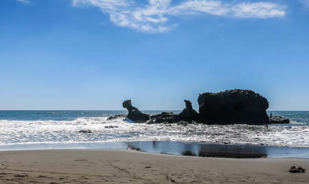 Rocks on El Tunco Beach at sunset. El Tunco, El Salvador.の写真素材