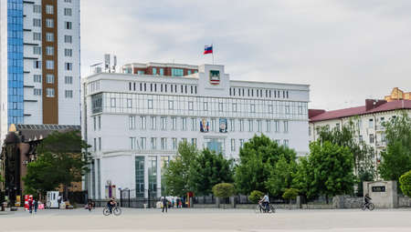 The building of the Council of Deputies of the city of Grozny with portraits of Vladimir Putin and Akhmad Kadyrov on the facade. Grozny, Chechen Republicのeditorial素材