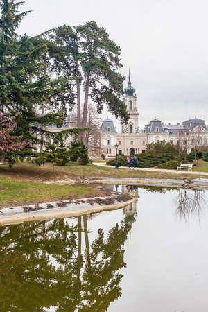 Green park with a view of the Beautiful baroque Festetics Castle in Keszthely Hungary, reflection in the lake pondのeditorial素材