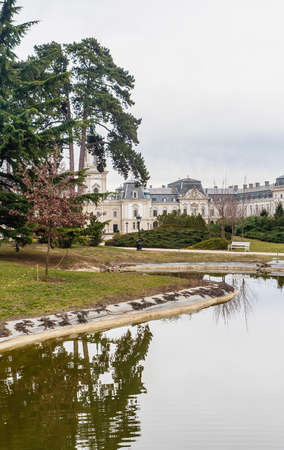 Green park with a view of the Beautiful baroque Festetics Castle in Keszthely Hungary, reflection in the lake pondのeditorial素材