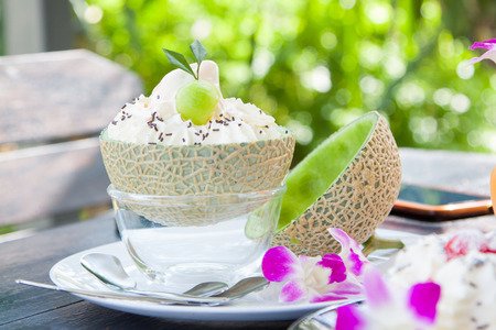 Melon filled with ice cream.の写真素材