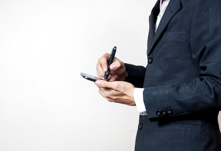 Businessman using a digital smartphoneの写真素材