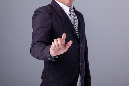 Business man with pointing to something or touchingの写真素材