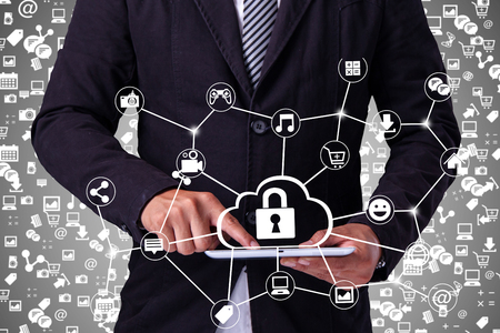 Hand touching tablet pc, social media concept,Security Protectionの写真素材