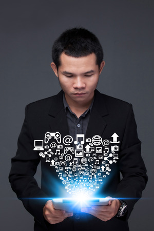 Business man Hand touching  tablet pc, social media conceptの写真素材
