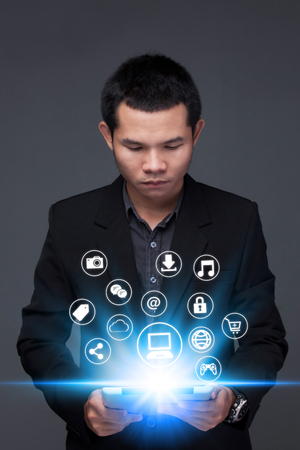 Business man Hand touching  tablet pc, social media conceptのeditorial素材