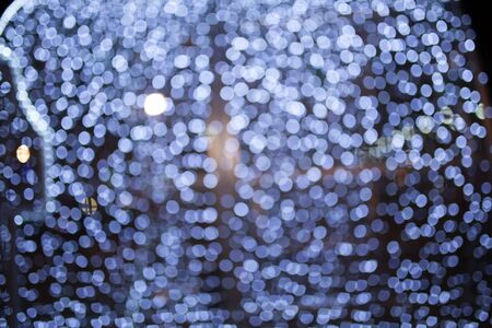 Christmas background with bokeh lightsの写真素材