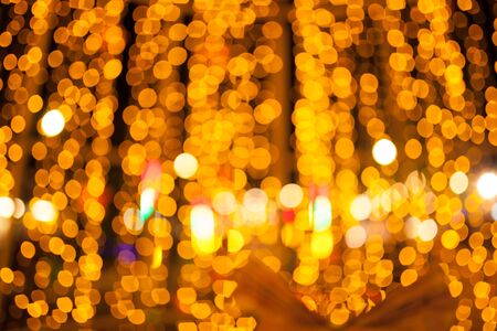 Gold bokeh abstract background defocused lights, Christmas light night bokehの写真素材