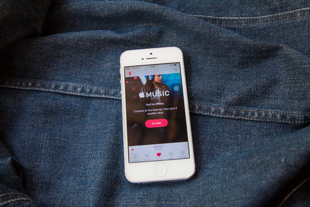 BANGKOK,THAILAND - April 18,2016:: Apple music application on the display of iphone and ipad gadgets. Apple Music is a music streaming service developed by Apple Inc.のeditorial素材