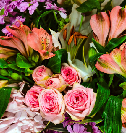 Beautiful bouquet of pink lilies, roses and other flowersの写真素材