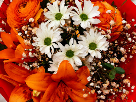 Orange Lilies White Daisies Baby's Breath Mixed Bouquet Bright Summer Flowers Fresh Floral Arrangement Wedding Celebration Natural Beauty Professional Photography Colorful Blooms Rの写真素材