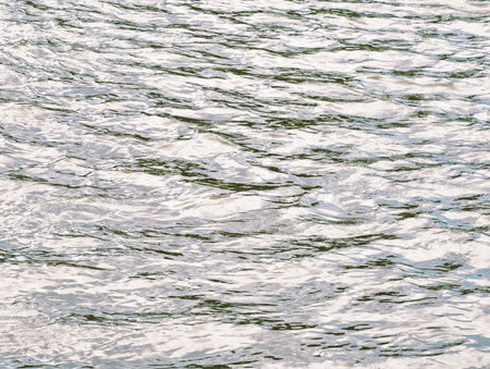 Calming Water Surface with Gentle Reflections - Ethereal Aquatic Textures for Relaxation, Nature Designs, and Tranquil Backgroundsの写真素材