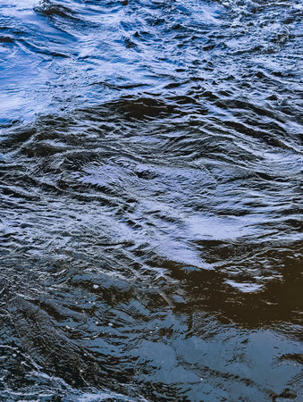 Mesmerizing Deep Blue Water Surface with Dynamic Patterns â€“ A Striking Aquatic Scene Perfect...
