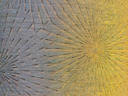 abstract background with yellow and blue rays of light on the fabric