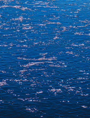 Blue Water Texture: Shimmering Reflective Surface Ideal for Digital Backdrops, Minimalist Wallpapers, Social Media Graphics, and Advertising Content to Enhance Web Design and Digitの写真素材