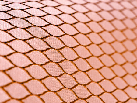 Fabric texture with a pattern of orange and yellow colors. macro