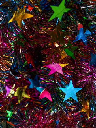 Colorful Holographic Stars with Rainbow Tinsel Festive Celebration Decoration Party Background Shiny Metallic Confetti Display. Ultra High Resolutionの写真素材