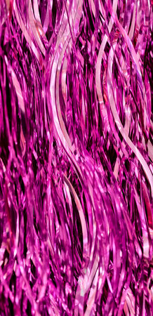 Vibrant Pink Magenta Metallic Tinsel Streamers Abstract Background Festive Party Decoration Shiny Holographic Texture Designの写真素材