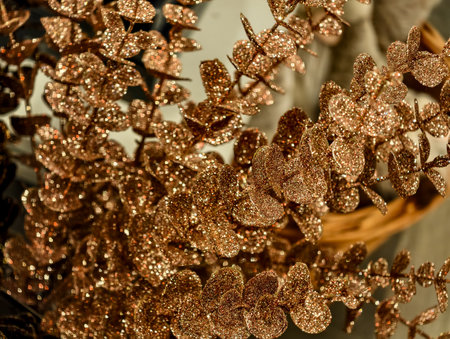 Close-up of golden Christmas tree decorations in the shop window.の写真素材