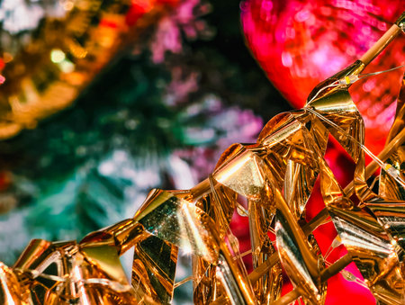 Gold Metallic Tinsel Garland Christmas Tree Decoration Colorful Bokeh Lights Festive Holiday Background Retro Shiny Party Celebration Wallpaperの写真素材