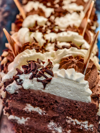 Chocolate Mousse Cake Row Vertical Photo Whipped Cream and Shavings Close-Up High Resolution Dessert...