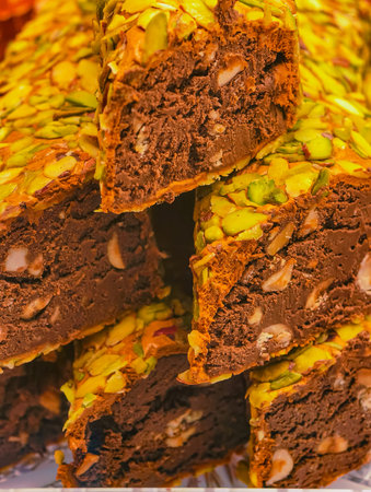 Chocolate Pistachio Halva Photo with Mixed Nut Filling Middle Eastern Confectionery Close-Up Macroの写真素材