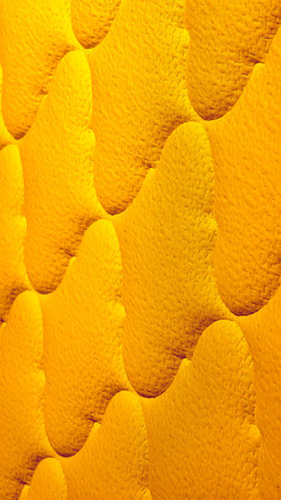 Radiant Golden Yellow Quilted Fabric Texture as a Luminous 8K Wallpaper and Vertical Background...