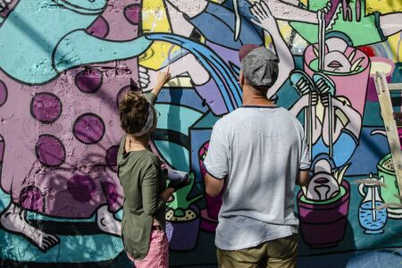 ISRAEL, TEL AVIV, 21.04.2018: Russian artists paint graffiti on the wall of an abandoned building in Tel Avivのeditorial素材
