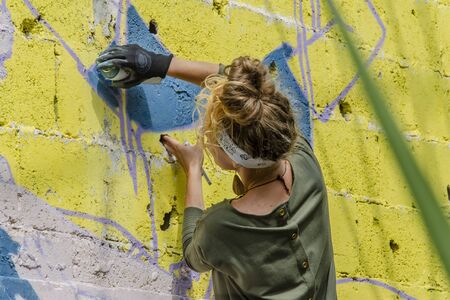 ISRAEL, TEL AVIV, 21.04.2018: Russian artists paint graffiti on the wall of an abandoned building in Tel Avivのeditorial素材