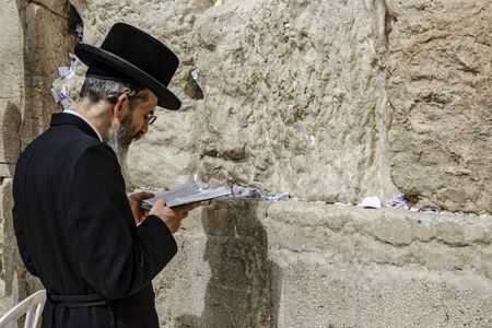 ISRAEL. JERUSALEM. 12.05.2018 - Orthodox jewish man prays in The western wall , An Important Jewish religious site located in the Old City of Jerusalemのeditorial素材