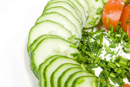Fresh vegetable salad - tomatoes and cucumber with green onionの写真素材