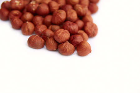 Close-up of hazelnuts on white backgroundの写真素材