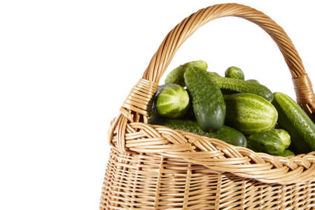 Cucumber on basket isolated on white backgroundの写真素材