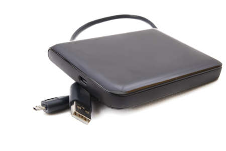 Portable external HDD hard disk drive with USB cable on white backgroundの写真素材