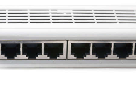 Closeup image of a network switch holes unplugged