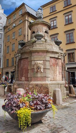 Medieval fountain-well on Stortorgsbrunnen square in Stockholm, Sweden の写真素材
