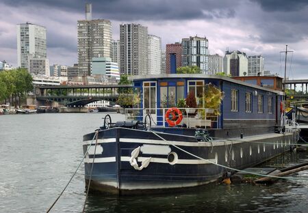 The barge reconstructed for habitation on river Seine in Paris, France.の写真素材