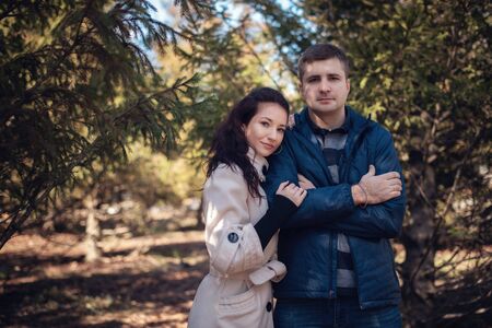 Young couple in love outdoor. They are smiling and looking at each other
