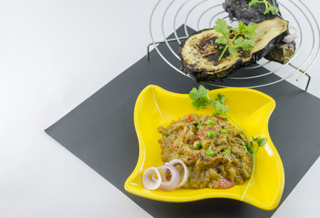 Baigan Bhartha is a popular Indian dish. Eggplants are roasted and then cooked with onions,tomatoes,chilly and other spices.の写真素材