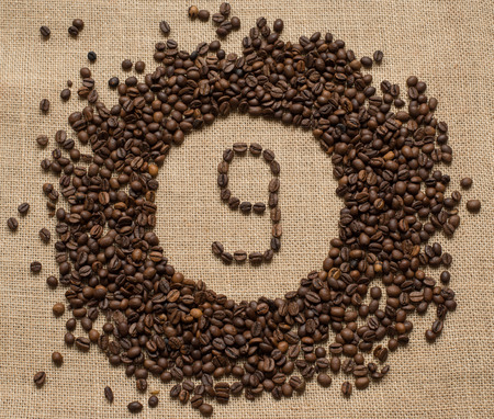 Numbers from coffee beans on burlap backgroundの写真素材